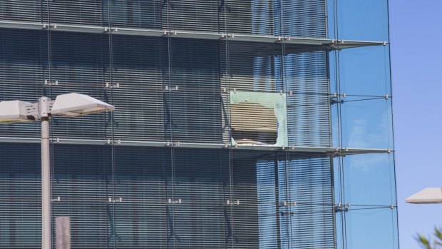 Another broken window at the ASIO headquarters in Canberra.