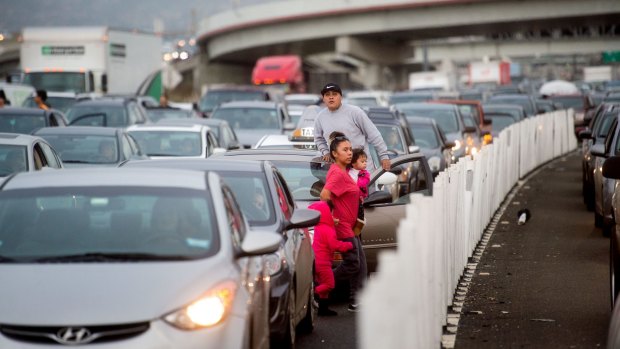 Motorists leave their vehicles as Black Lives Matter protesters block traffic on the San Francisco-Oakland Bay Bridge in San Francisco in January. 