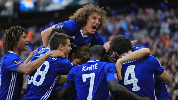 David Luiz (centre) has splashed out on his teammates after their EPL title win.