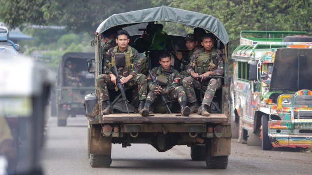 Soldiers ride a military vehicle on the outskirts of Marawi city, southern Philippines, earlier this month.