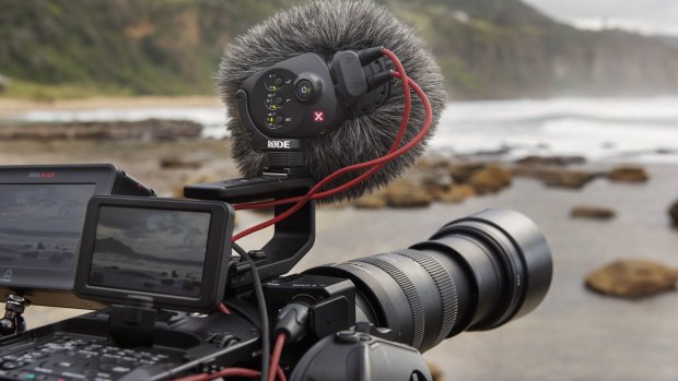 A camera with a RODE microphone attached.