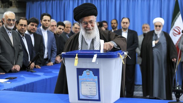 Iran's Supreme Leader Ayatollah Ali Khamenei casts his ballot during parliamentary and Experts Assembly elections in Tehran.