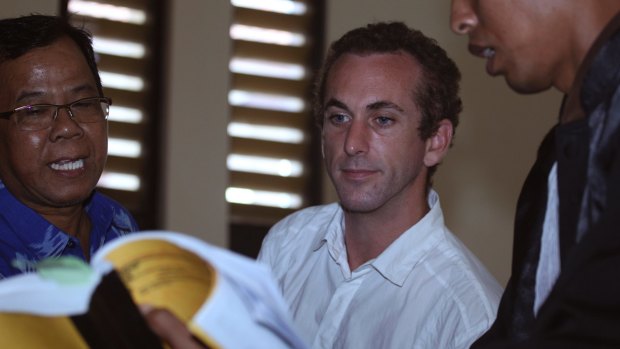 British man David Taylor, centre, is presented with evidence during his trial in Bali on November 16.