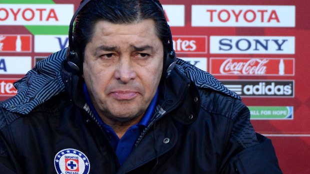 Guarded: Cruz Azul's head coach Luis Fernando Tena speaks during a press conference in the Moroccan capital Rabat.