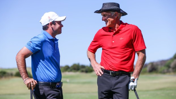 Greg Norman chatting with rising young star Antonio Murdaca on the practice range at New South Wales Golf Club during a golf clinic.