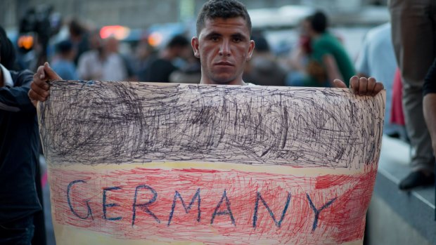A migrant protests outside Keleti station in central Budapest.