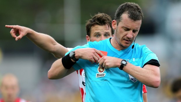 Robbie Wielaert of Melbourne City questions the decision by referee Peter Green to award a red card to City goalkeeper Tando Velaphi.