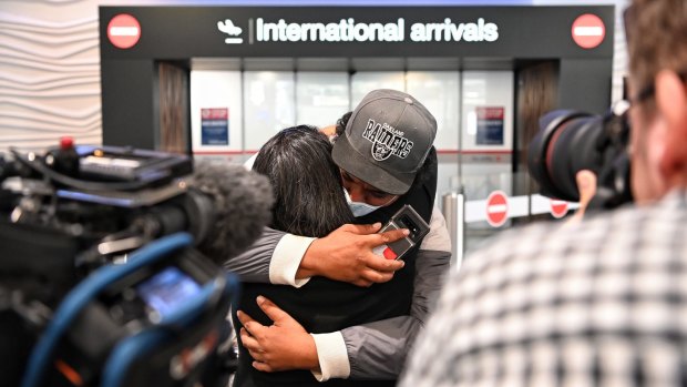 Emotions bubble over: Passengers arrive at Auckland airline after the first trans-Tasman bubble flight.