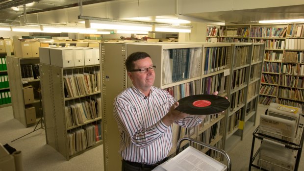 Out of the vault: Arts collection manager Dermot McCaul in the State Library of Victoria basement where part of its vast vinyl record collection is stored.