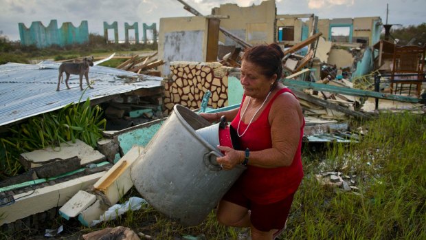 Local residents clean up after Hurricane Irma caused destruction in Cuba earlier this month. Hurricane Maria is following a similar path.