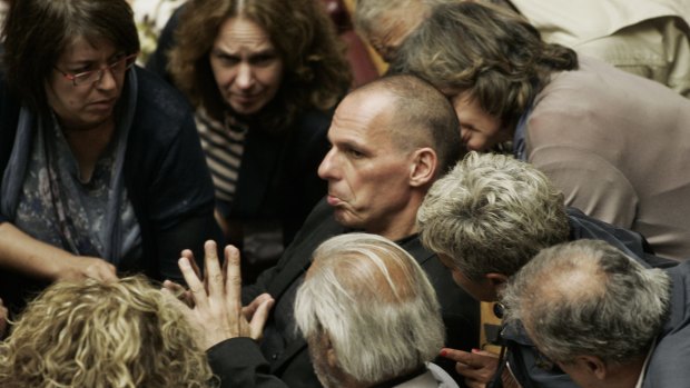 Greek Finance Minister Yanis Varoufakis, who is a dual Greek-Australian national, speaks to other lawmakers during a parliamentary session in Athens on Sunday.
