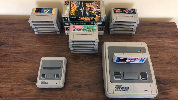 The tiny SNES Mini, alongside an original Aussie SNES and 20 games.