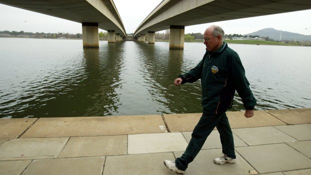 Then prime minister John Howard going for his walk this morning around Lake Burley Griffin in Canberra in 2004.