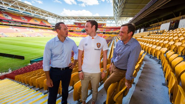 Minister for Sport Mick de Brenni , Roar player Corey Brown and member for Mt Coot-tha Steven Miles at the announcement of new screens that will be installed at Suncorp Stadium and The Gabba in 2017.
