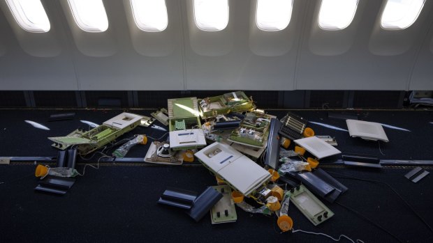 Oxygen masks lie on the floor of a Boeing 767 during its conversion.