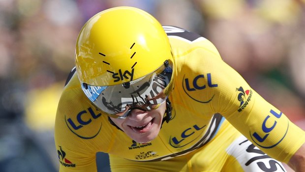 Britain's Chris Froome crosses the finish line to win the 18th stage of the Tour de France.