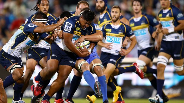 Ita Vaea of the Brumbies is tackled during the Brumbies' clash with the Force.