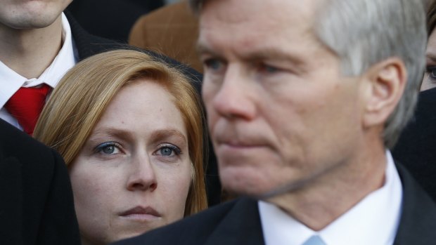 Cailin Young, daughter of Bob McDonnell, right, listens to her father outside federal court in Richmond.