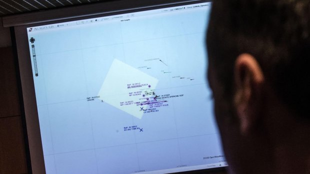 An Italian coast guard officer using a monitor showing the ships navigating the area where the boat believed to be crowded with perhaps as many as 700 migrants capsized in the waters north of Libya on the weekend. 