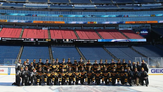 The Boston Bruins pose for a team photo prior to practice at Gillette Stadium ahead of the Winter Classic.