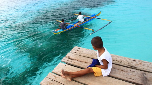 Children at Nusaniwe Beach on the island of Ambon.