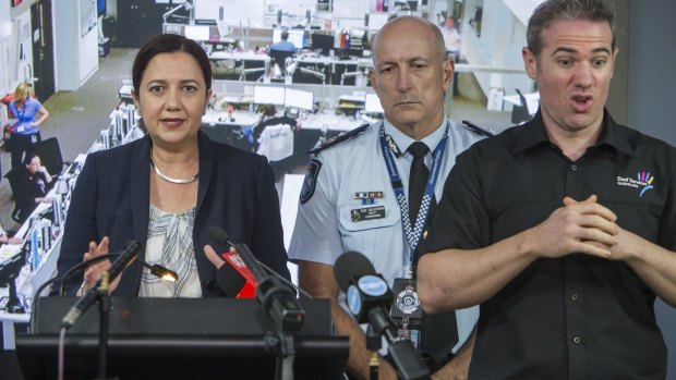 Queensland Premier Annastacia Palaszczuk speaks to the media along side the Queensland Police Service Deputy Commissioner Steve Gollschewski and Interpreter Mark Cave in the Coordination Centre in Brisbane on Friday.