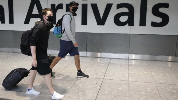 Passengers arrive at London's Heathrow Airport. Some Traveller readers believe Australians should be free to travel, under certain circumstances.