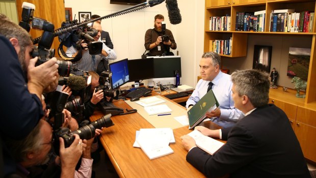 Treasurer Joe Hockey and Finance Minister Senator Mathias Cormann pose for the media on budget day in 2014.