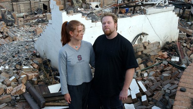 Jane and Owen Kenyon, at their destroyed Duffy home on January 28, 2003.