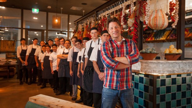 Chef Jamie Oliver - with a queue of his own chefs - during a visit to his Canberra Jamie's Italian restaurant last year. 