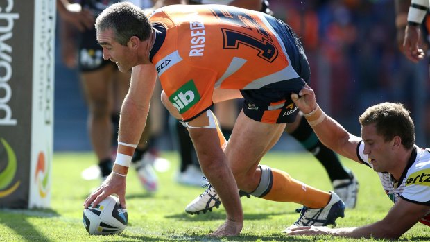 Winning feeling: Chris Houston of the Knights scores at Hunter Stadium.