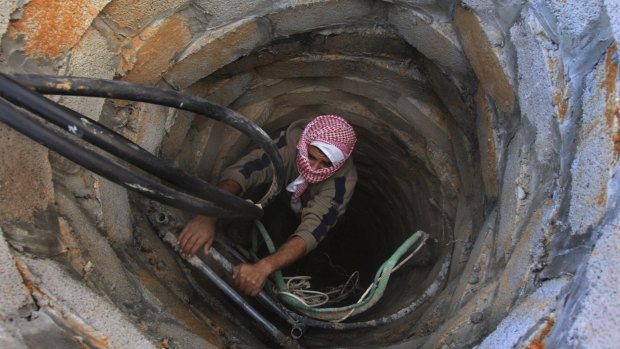 A Palestinian smuggler in a tunnel in 2008.