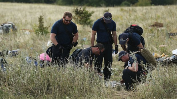 Australian Federal Police officers and their Dutch counterparts at the MH17 crash site.