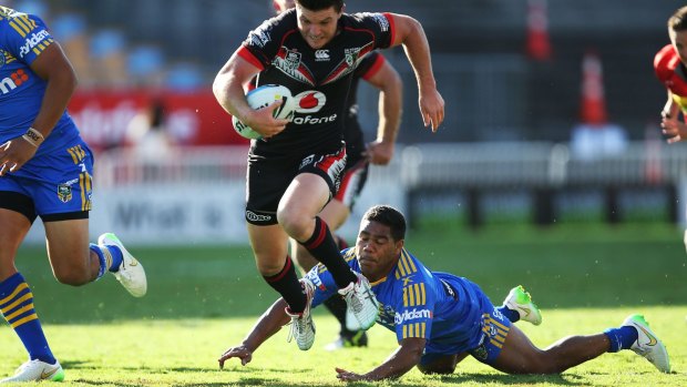 Missed tackle: Parramatta halfback Chris Sandow fails to reel in Warriors five-eighth Chad Townsend.