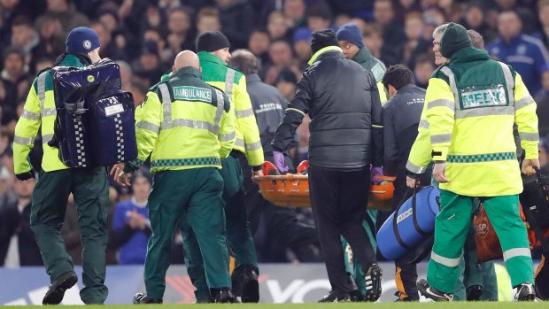 Hull City's Ryan Mason is carried on a stretcher.