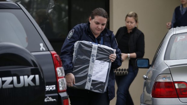 Police seize items during Saturday's counter-terrorism raids in Hallam.