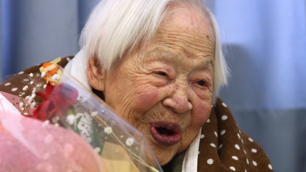 Misao Okawa, who is recognised by Guinness World Records as the world's oldest woman, reacts during her 115th birthday celebrations in 2013 in Osaka, Japan.