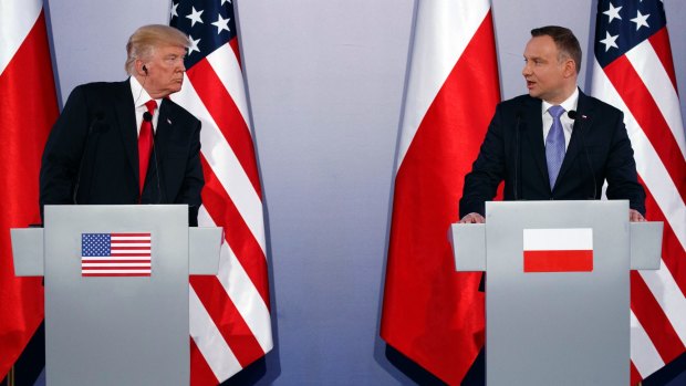 Polish President Andrzej Duda, right, and US President Donald Trump attend a news conference at Royal Castle, Warsaw.