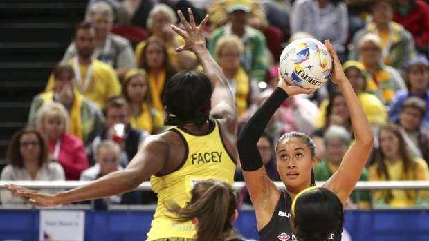 Jamaica's Stacian Facey leaps to try and block a shot on goal by New Zealand's Maria Tutaia.