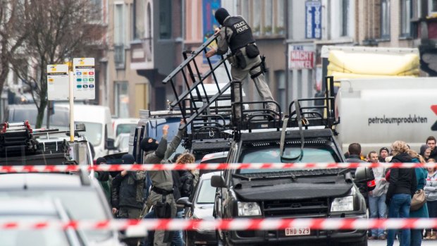Special forces police prepare as a man is taken hostage in Ghent. 