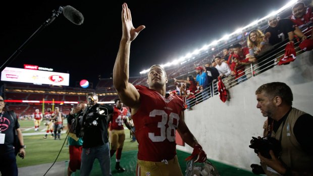 Jarryd Hayne #38 of the San Francisco 49ers walks off the field after their NFL preseason game against the San Diego Chargers at Levi's Stadium in Santa Clara, California.  