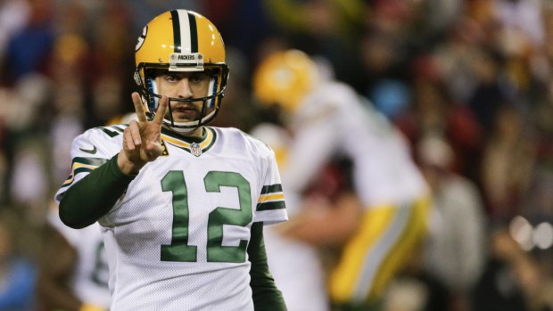 The money man: Green Bay Packers quarterback Aaron Rodgers signals during the NFL wild card playoff game against Washington.