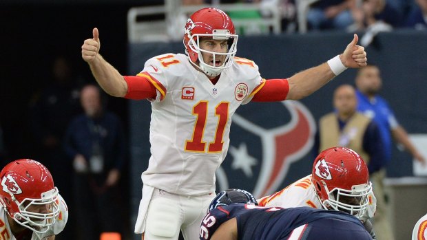 Two thumbs up: Chiefs quarterback Alex Smith calls a play during the first half of the NFL wild card playoff game against the Houston Texans in Houston. 