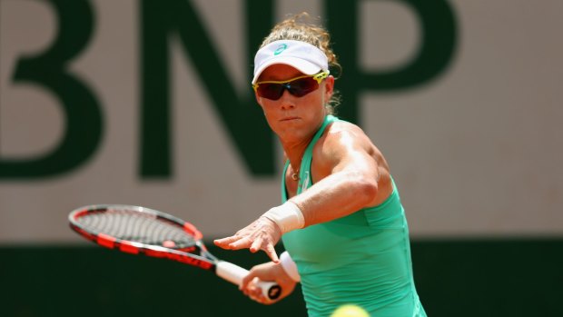 Samantha Stosur plays a forehand during her first-round match against Madison Brengle of the US. 