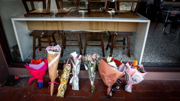 Tributes for Joseph Acquaro in front of his Brunswick East cafe on Wednesday.