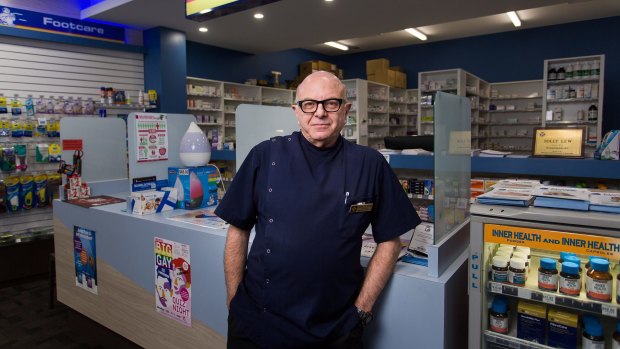 Solly Lew at his chemist in St Kilda. Chemist Warehouse has moved in next door. 