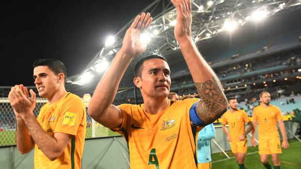 Next stop Central America: Australia's Tim Cahill (centre) and Tomas Rogic acknowledge the crowd after their win over Syria at ANZ Stadium.