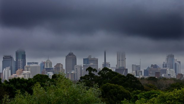 Clouds sever the Sydney skyline on Monday.