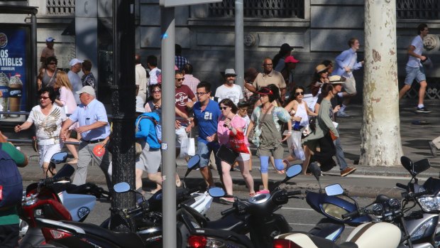 People flee in terror after the Barcelona van attack.