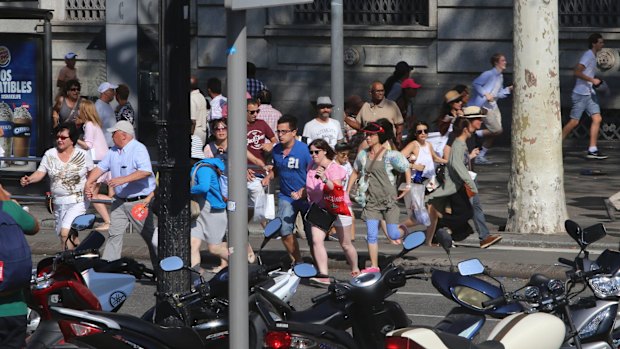 People flee in terror after the Barcelona van attack.